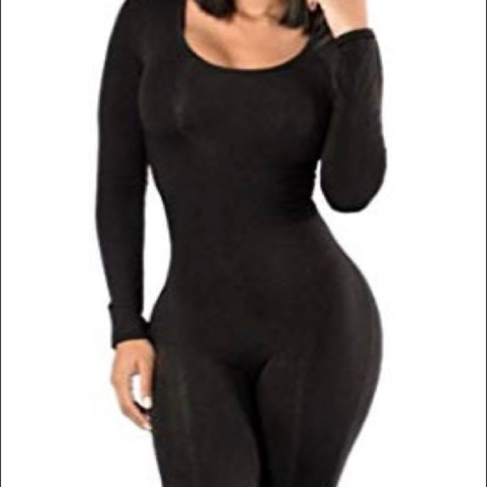 Like New. Black long sleeved bodysuit/jumpsuit